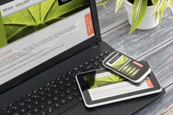 Responsive website design displayed on laptop, tablet, and smartphone